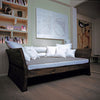 Mufti daybed in house with white cushions and art