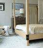 four poster bed in store with stool