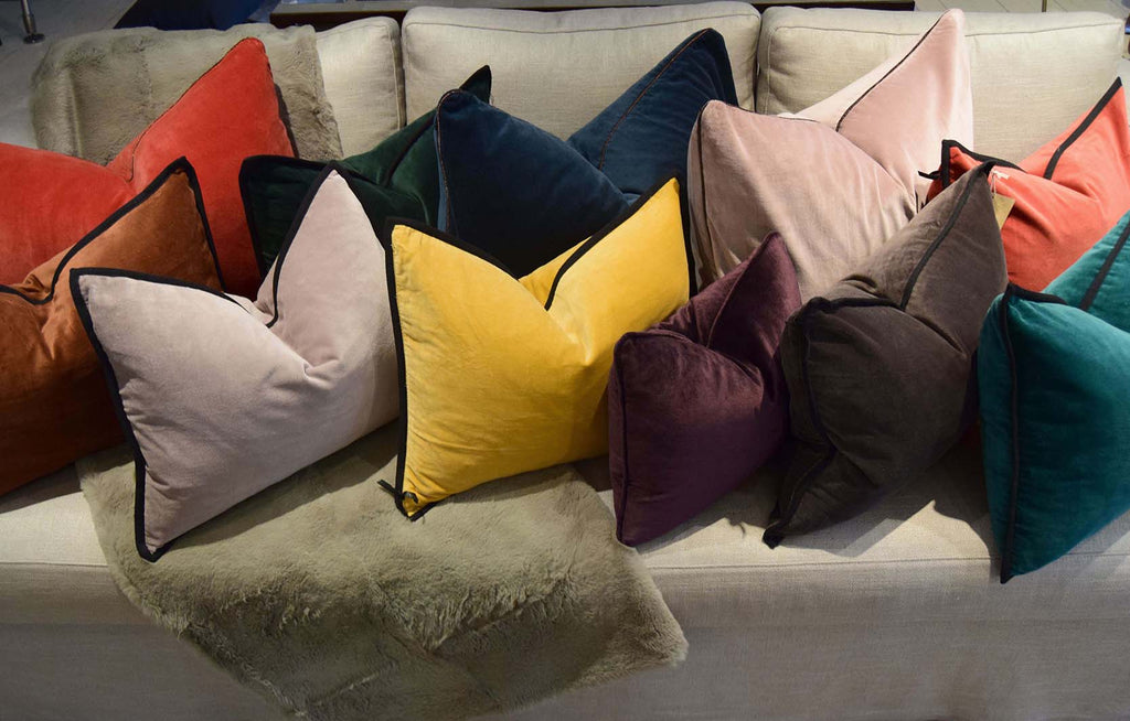 Aristote Cushion in various colours on sofa