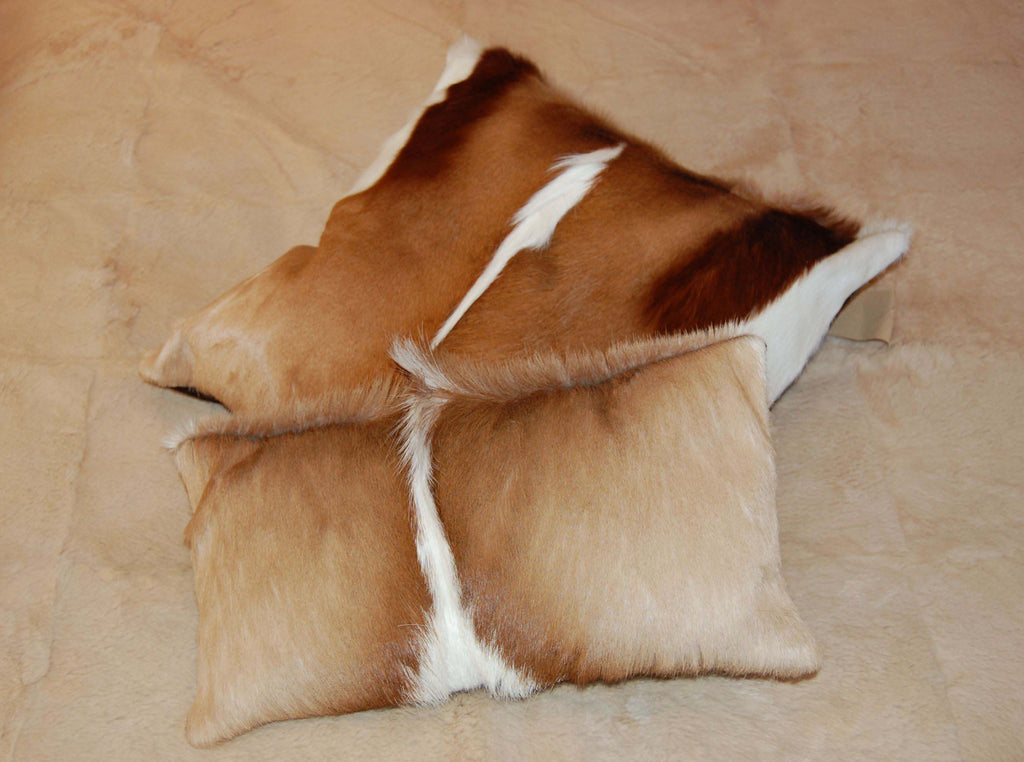 Springbok Hide Cushions on bed