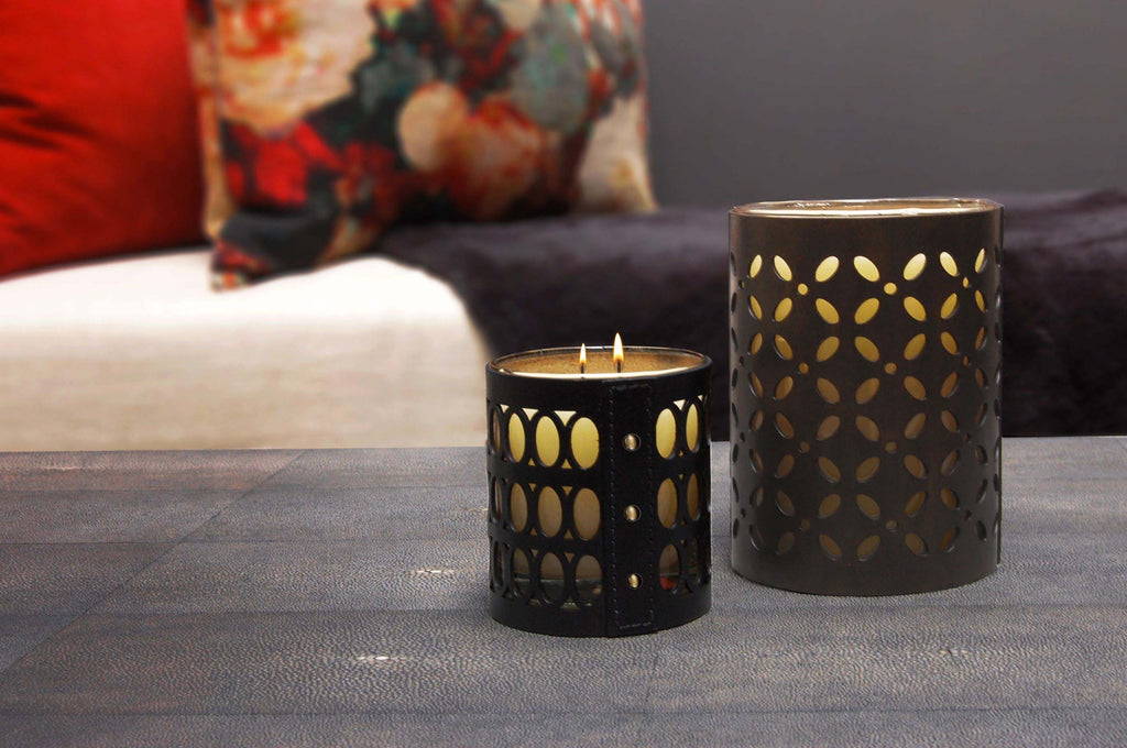 Tall and Small Geometric candles on shagreen table with cushions